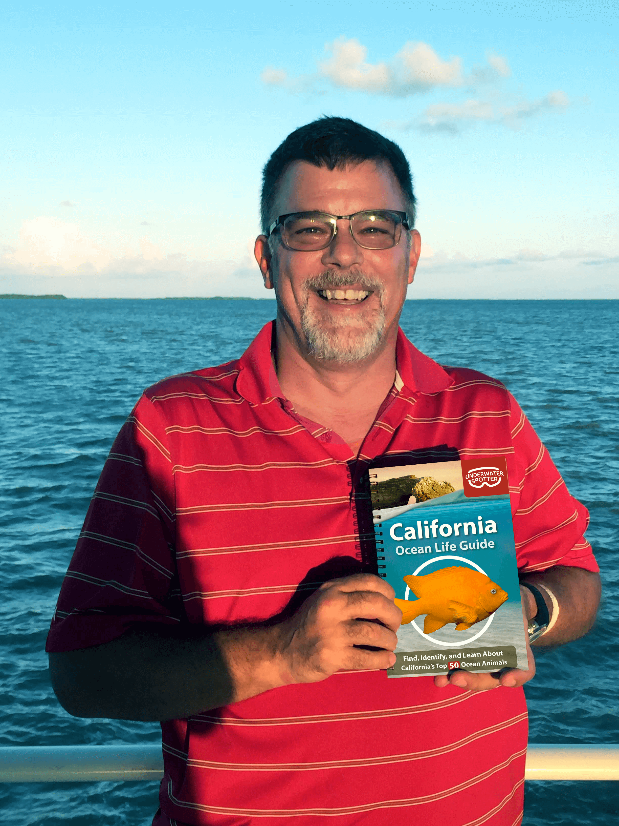 california underwater spotter and smiling male customer holding book